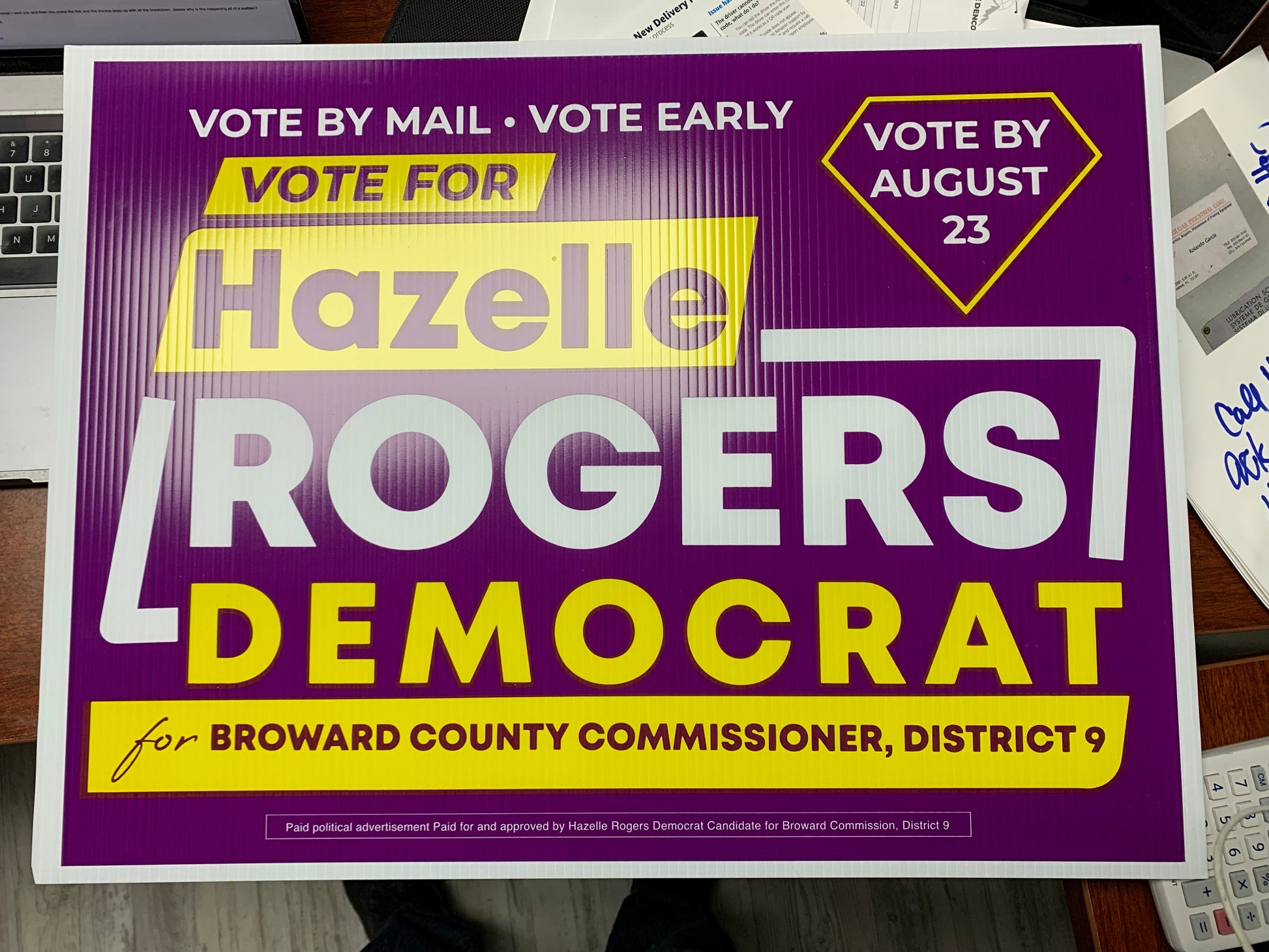 Political poster for Hazelie Rogers Democrat on a surface with a blurred background