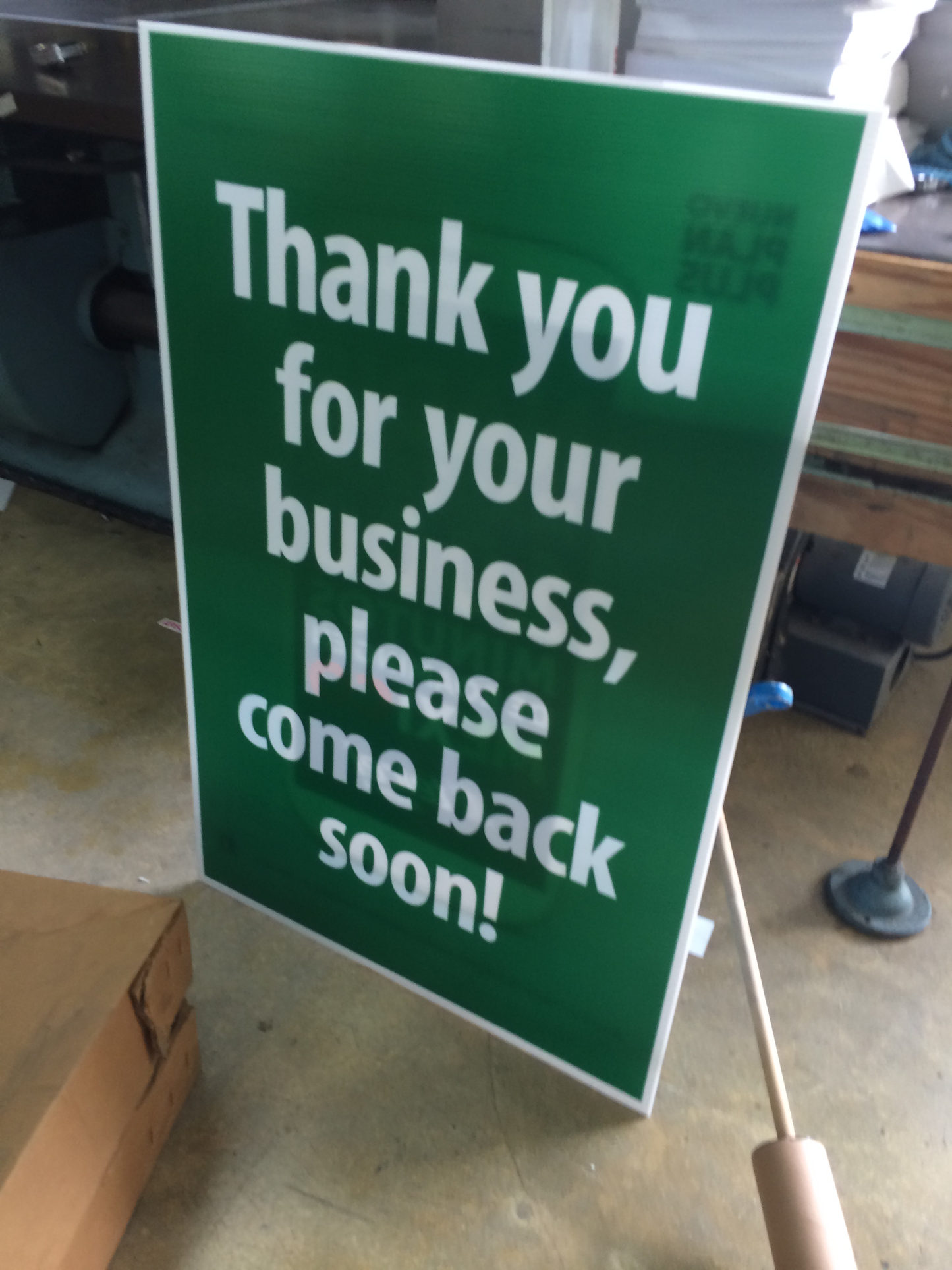 Green THANK YOU COROPLAST sign with white text