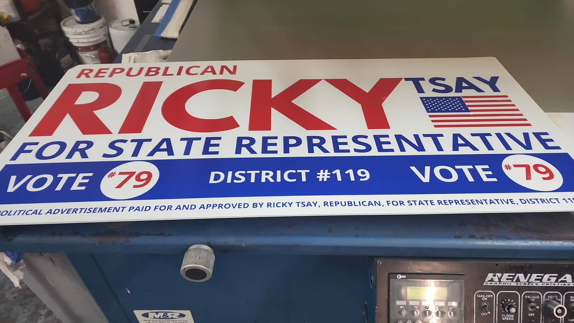 Political campaign sign for Republican Ricky Tsay for State Representative on a machine.